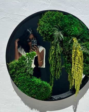 Botanical Mirror designed by James Ammann, featuring a central reflective surface surrounded by preserved moss and soft botanical textures, blending nature with refined modern design. Moss Art Installations